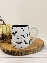 Load image into Gallery viewer, #002 - 16 oz. Bat patterned white speckled mug with black inside
