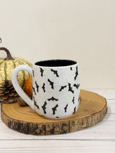 Load image into Gallery viewer, #002 - 16 oz. Bat patterned white speckled mug with black inside
