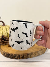Load image into Gallery viewer, #002 - 16 oz. Bat patterned white speckled mug with black inside

