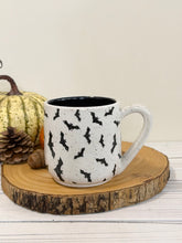 Load image into Gallery viewer, #003 - 16 oz. Bat patterned white speckled mug with black inside
