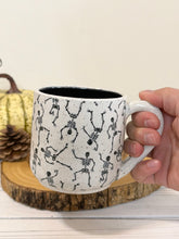 Load image into Gallery viewer, #004 - 16 oz. Skeleton patterned white speckled mug with black inside
