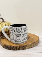 Load image into Gallery viewer, #006 - 16 oz. Ghost patterned white speckled mug with black inside
