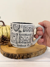 Load image into Gallery viewer, #006 - 16 oz. Ghost patterned white speckled mug with black inside
