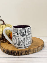 Load image into Gallery viewer, #007 - 16 oz. Ghost patterned white speckled mug with dark purple inside
