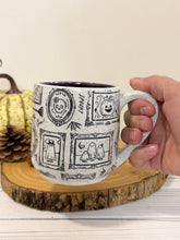 Load image into Gallery viewer, #007 - 16 oz. Ghost patterned white speckled mug with dark purple inside
