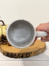 Load image into Gallery viewer, #013 - 16 oz. Sweater weather on white speckled mug
