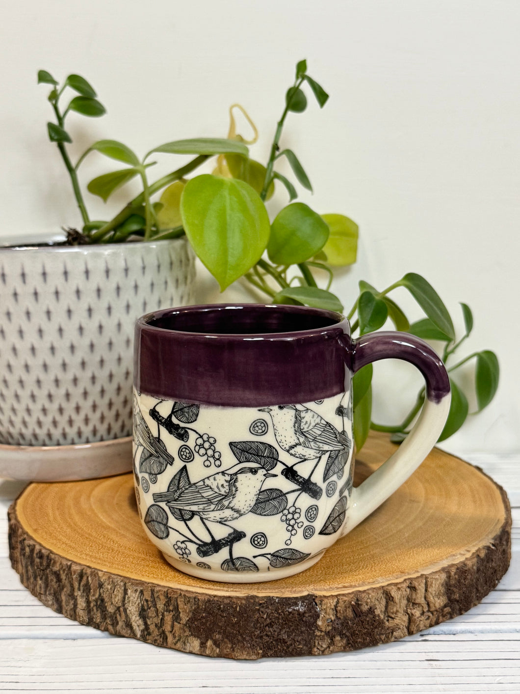 #001- 14 oz. Bird patterned mug with purple rim