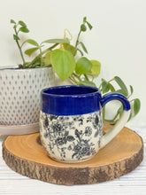 Load image into Gallery viewer, #004 - 14-16 oz. Floral bouquet patterned mug with cobalt blue rim
