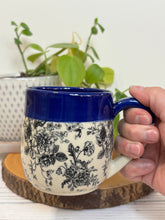 Load image into Gallery viewer, #004 - 14-16 oz. Floral bouquet patterned mug with cobalt blue rim
