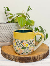 Load image into Gallery viewer, #012 - 14-16 oz. Flower patterned mug with yellow rim green inside
