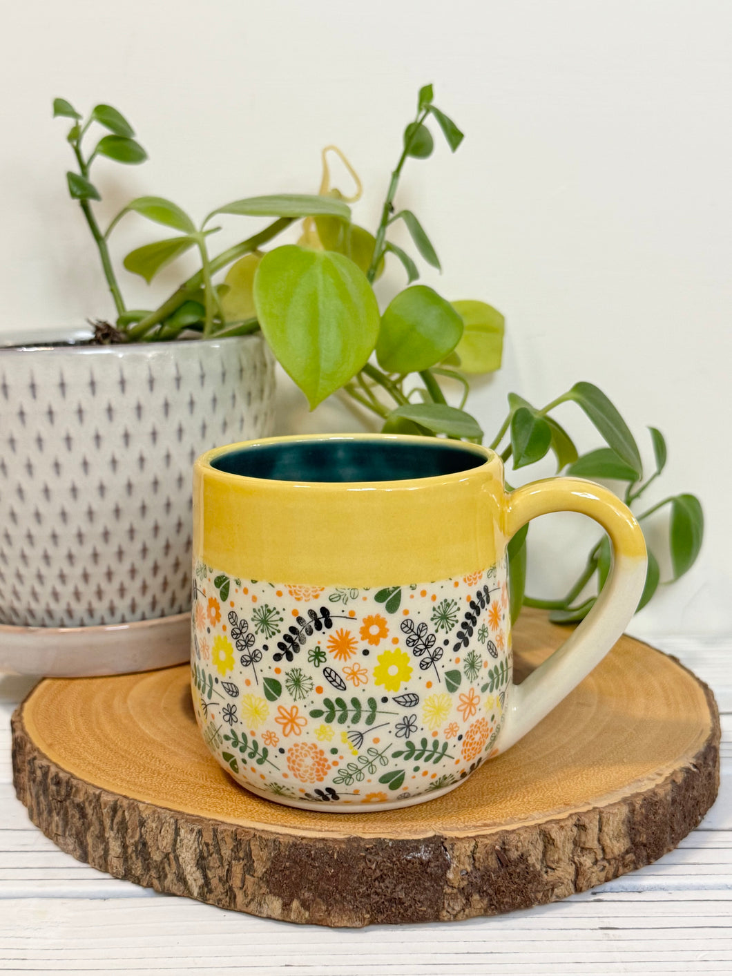 #012 - 14-16 oz. Flower patterned mug with yellow rim green inside