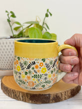 Load image into Gallery viewer, #012 - 14-16 oz. Flower patterned mug with yellow rim green inside
