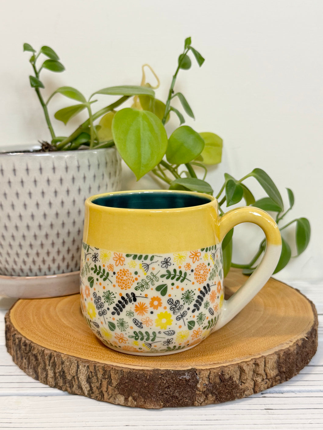 #013 - 16 oz. Flower patterned mug with yellow rim green inside *see notes