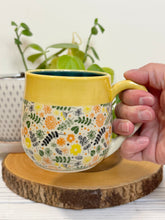 Load image into Gallery viewer, #013 - 16 oz. Flower patterned mug with yellow rim green inside *see notes
