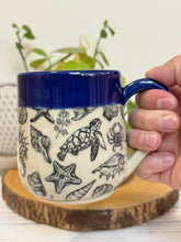 Load image into Gallery viewer, #015 - 14-16 oz. Sea creature patterned mug with cobalt blue rim
