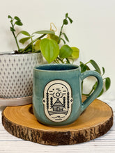 Load image into Gallery viewer, #021 - 16 oz. Cabin mug with green glaze (pattern on bare clay) and blue inside *see note
