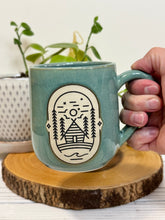 Load image into Gallery viewer, #021 - 16 oz. Cabin mug with green glaze (pattern on bare clay) and blue inside *see note
