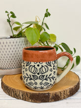 Load image into Gallery viewer, #025 - 16 oz. Autumn patterned mug with burnt orange rim and blue inside
