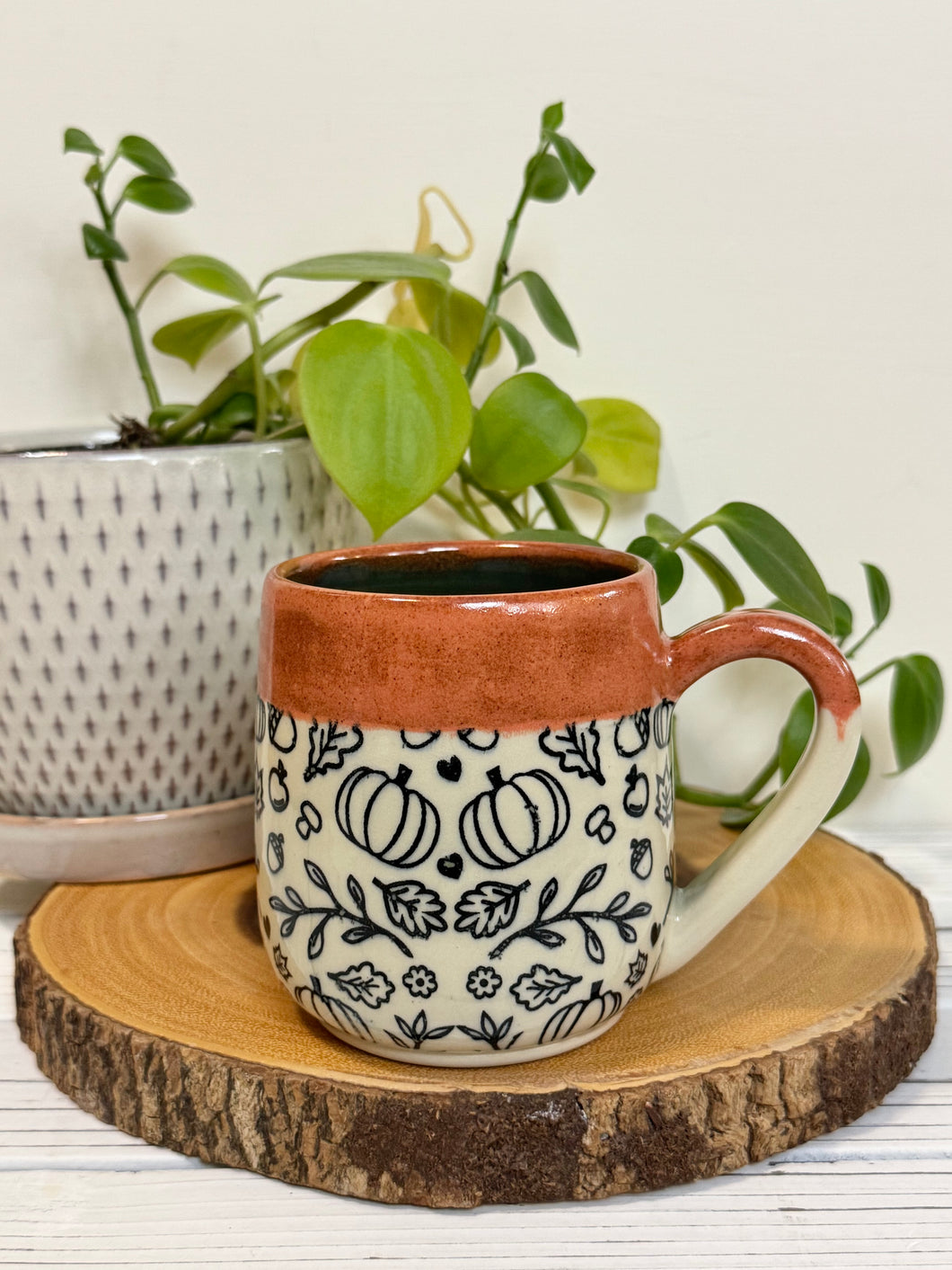 #025 - 16 oz. Autumn patterned mug with burnt orange rim and blue inside