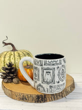 Load image into Gallery viewer, #001 - 16 oz. White speckled mug with Halloween ghost patterns. Black inside. * See notes
