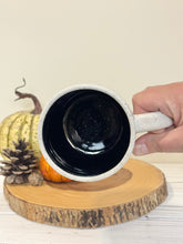 Load image into Gallery viewer, #004 - 18 oz. White speckled mug with Halloween ghost patterns. Black inside.
