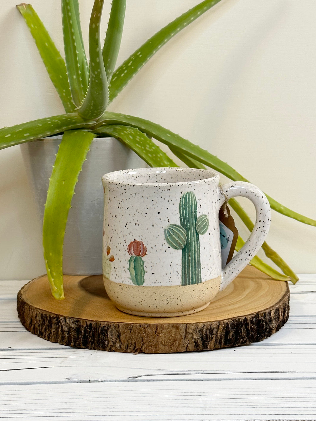 #001 - 16 oz. Cactus pattern on White speckled mug with bare clay at bottom