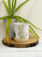 Load image into Gallery viewer, #001 - 16 oz. Cactus pattern on White speckled mug with bare clay at bottom
