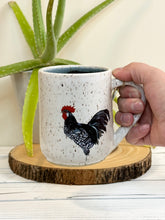 Load image into Gallery viewer, #003 - 16 oz. white speckled rooster mug with blue inside
