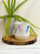 Load image into Gallery viewer, #004 - 16 oz. Jelly fish pattern on White speckled mug with bare clay at bottom
