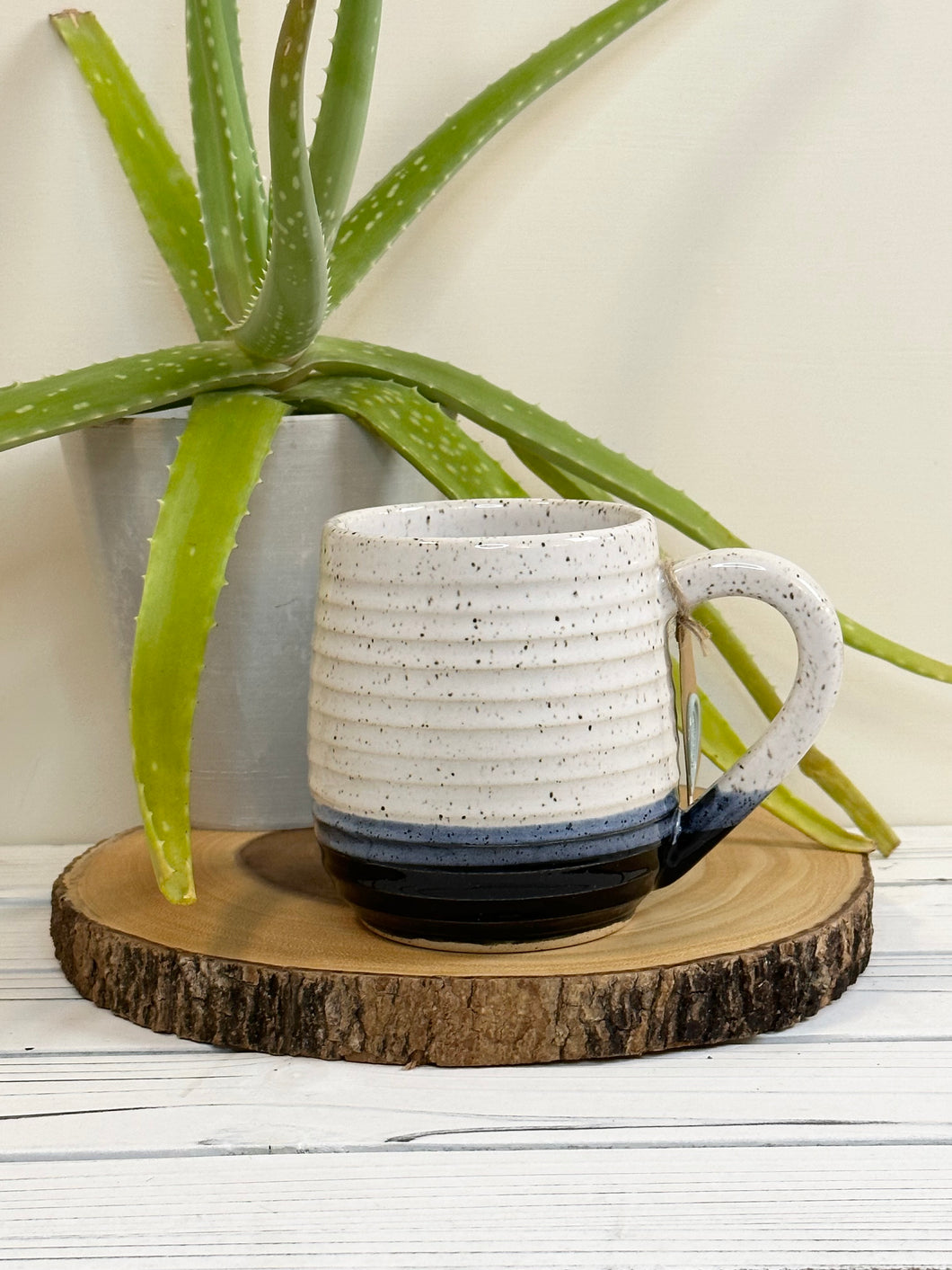 #015 - 18 oz. White and black speckled, ridged mug