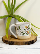 Load image into Gallery viewer, #008 - 16 oz. Lemon pattern on White speckled mug with bare clay at bottom
