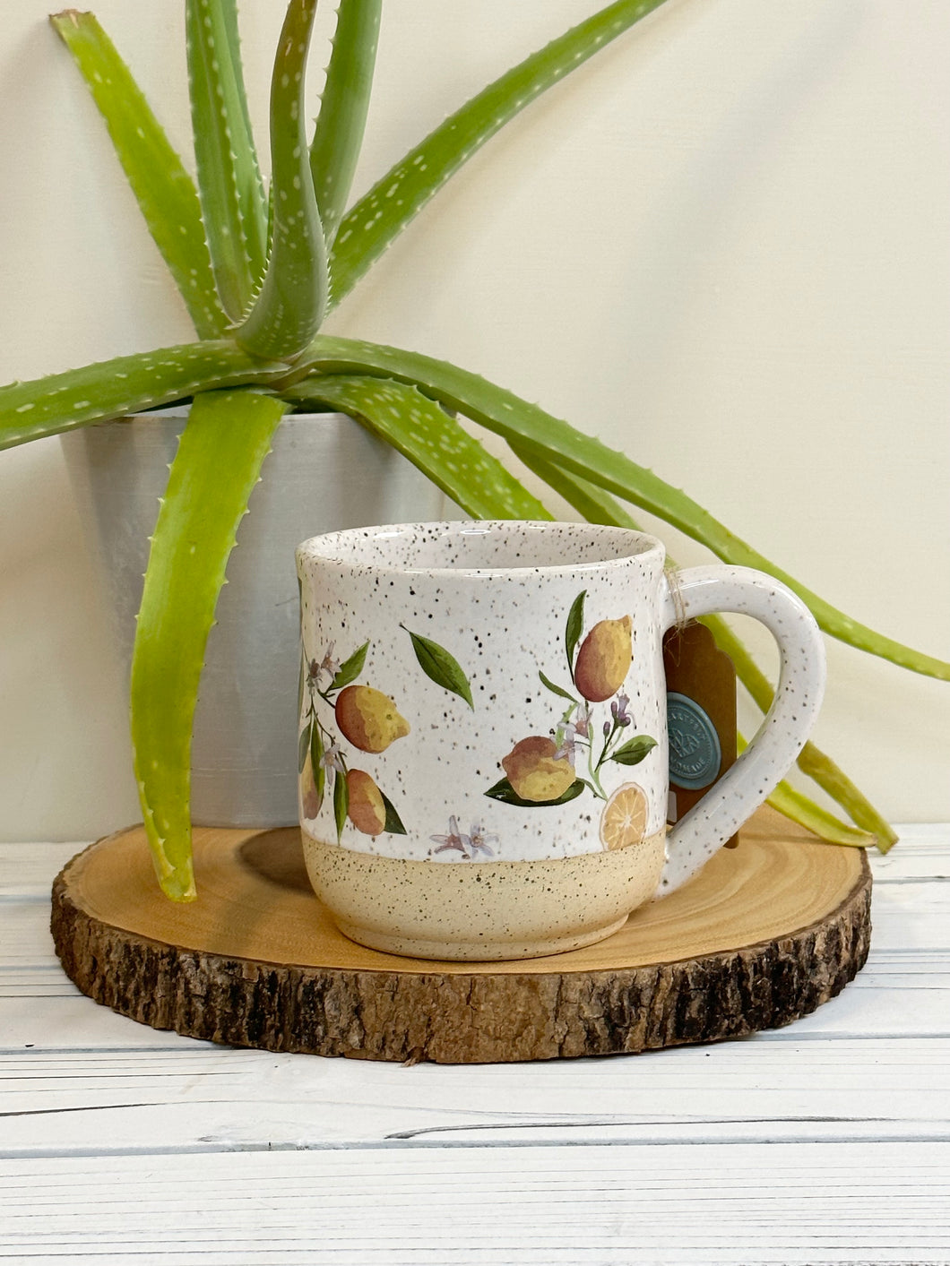 #009 - 16 oz. Lemon pattern on White speckled mug with bare clay at bottom