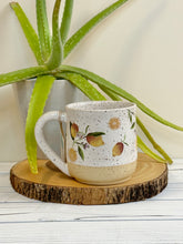 Load image into Gallery viewer, #009 - 16 oz. Lemon pattern on White speckled mug with bare clay at bottom
