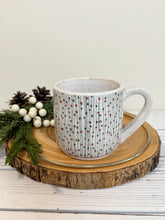 Load image into Gallery viewer, #010 - 14 oz. White speckled mug with green and red Christmas pattern
