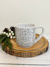 Load image into Gallery viewer, #009 - 14 oz. White speckled mug with green and red Christmas pattern
