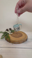 Load and play video in Gallery viewer, #020 - Mini pottery mug ornament with black snowflake pattern with light blue rim
