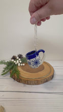 Load and play video in Gallery viewer, #016 - Mini pottery mug ornament with blue snowflake pattern with cobalt blue rim
